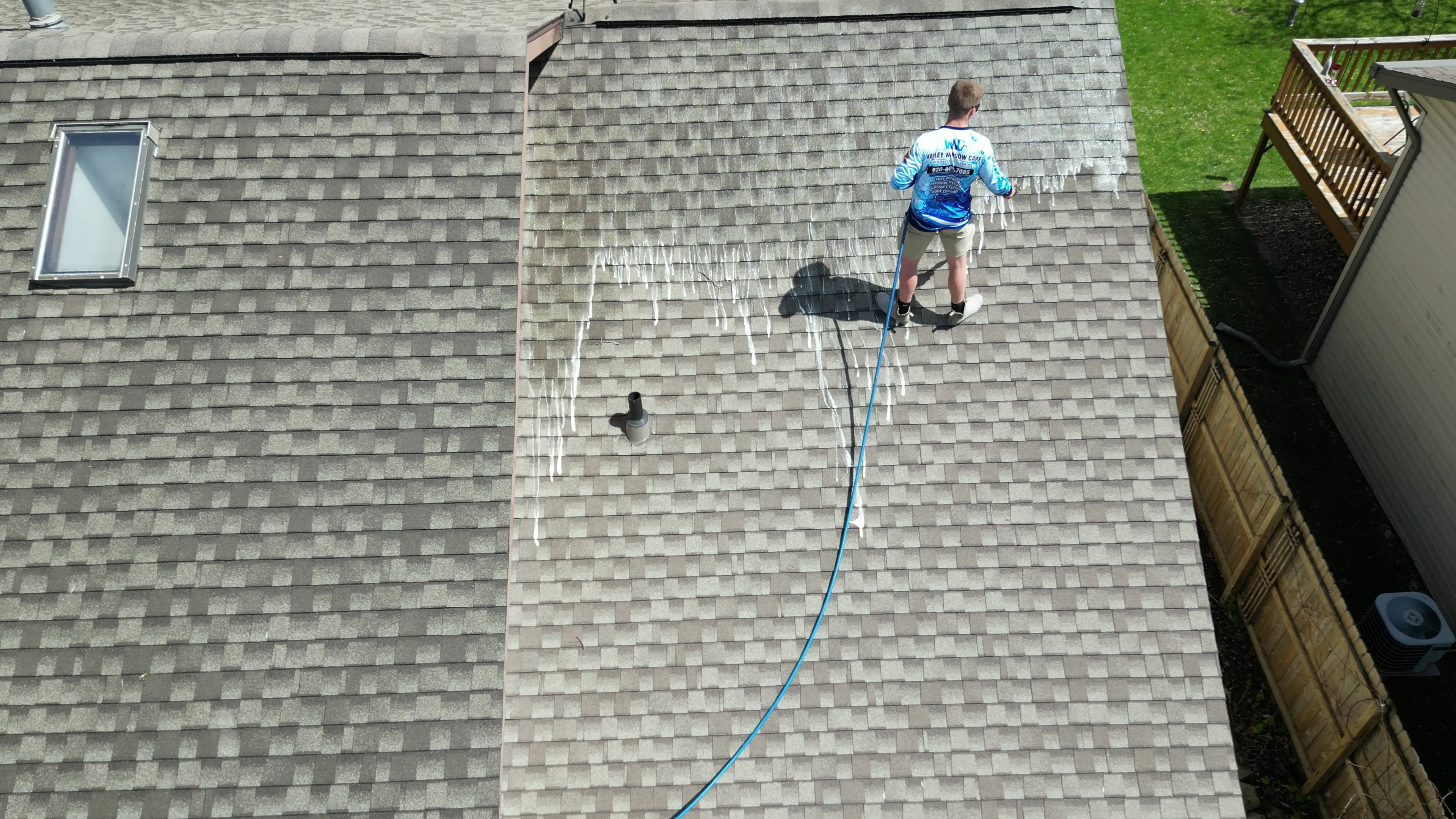 Soft washing asphalt shingle roof